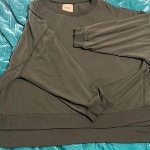 Olive green oversized long sleeve top size L.